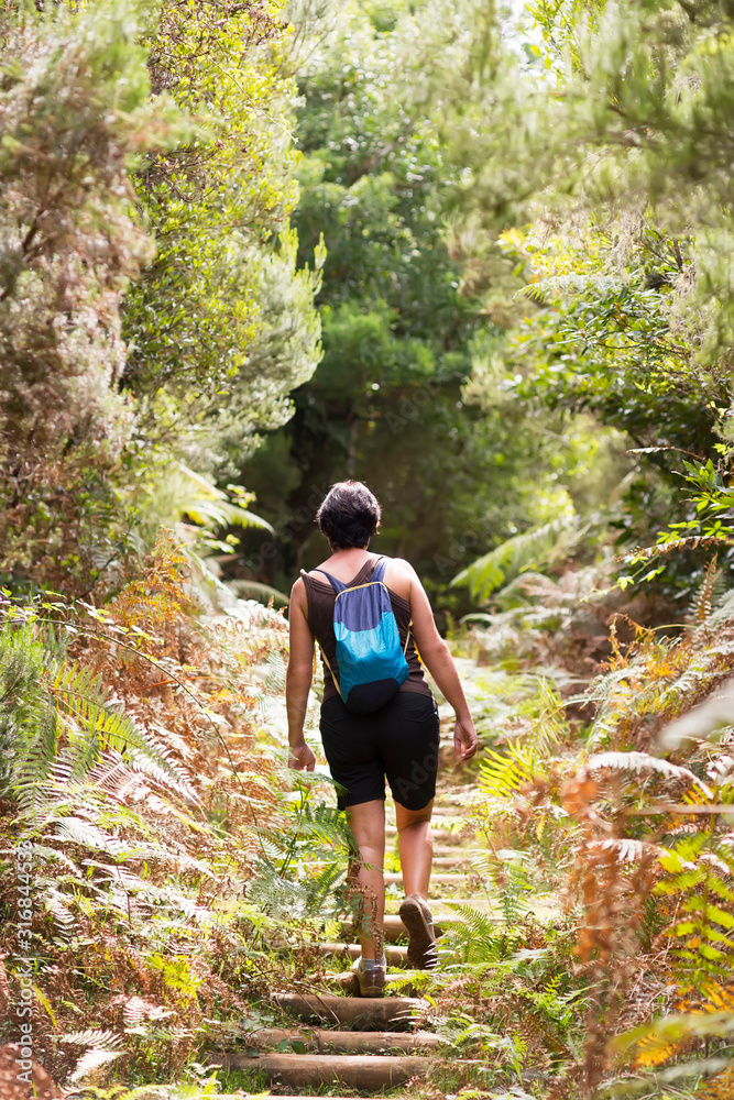 brave woman free in trekking hiking , Madeira island routes