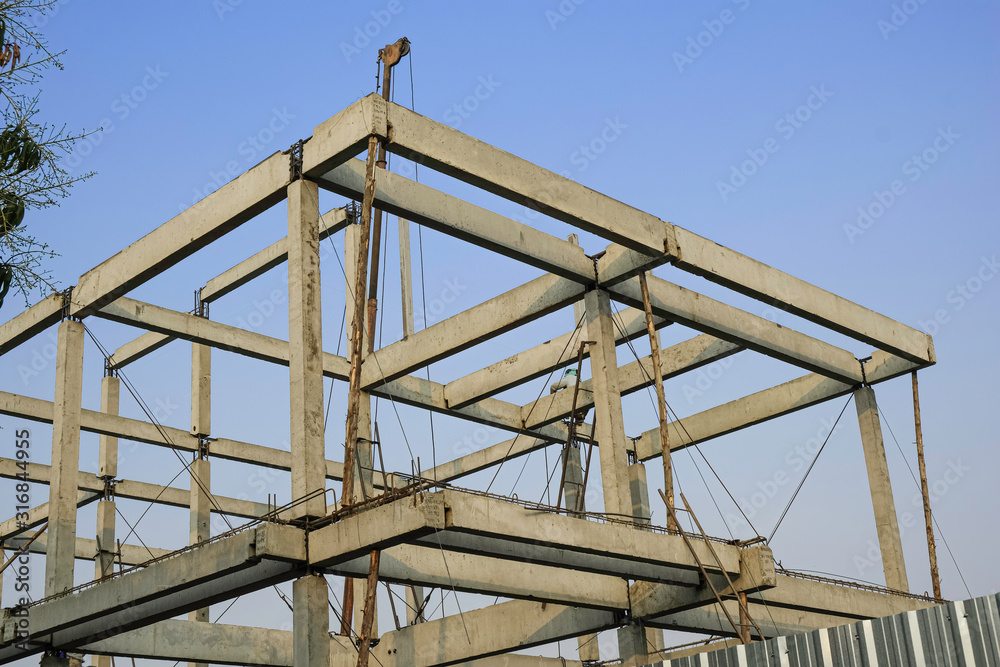 overview house structure cement purlin and rafter. worker man working high level. overview house structure cement purlin and rafter. worker man working high level.