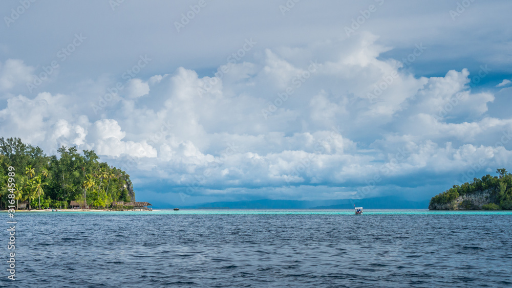 Strait between Kri and Monsuar Island. Raja Ampat, Indonesia, West Papua Strait between Kri and Monsuar Island. Raja Ampat, Indonesia, West Papua