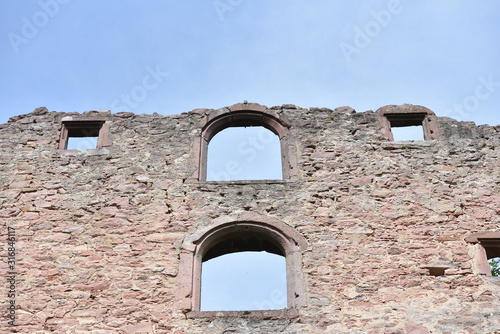Stone wall ruins of an old castle of Schloss Neuenburg in Germany  against a blue sky with text space
