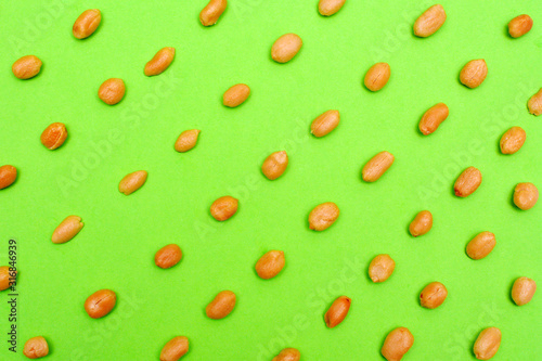 Peanuts on a green background art design.