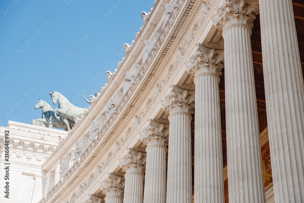 Columns of building on Venice Square in Rome Italy, blue sky Columns of building on Venice Square in Rome Italy, blue sky