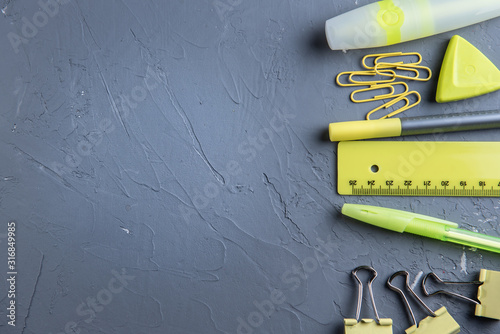 yellow stationery on a gray concrete background