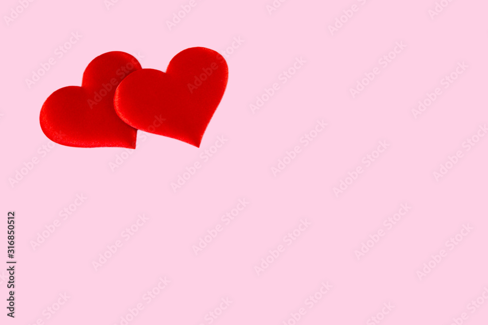 red hearts scattered on a pink background