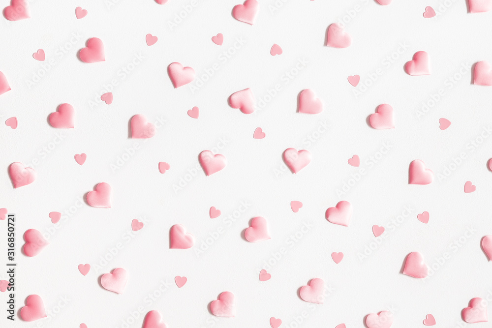 Valentine's Day background. Pink hearts on white background. Valentines day concept. Flat lay, top view