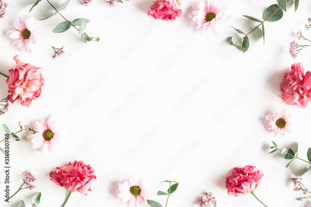 Fototapeta Flowers composition. Frame made of pink flowers and eucalyptus branches on white background. Valentines day, mothers day, womens day concept. Flat lay, top view