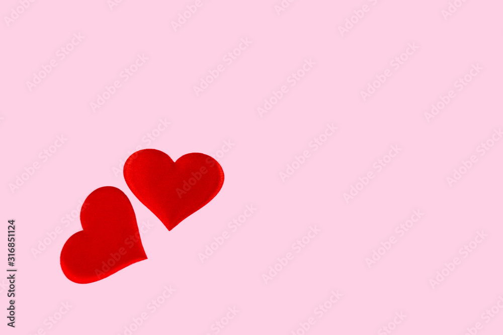 red hearts scattered on a pink background