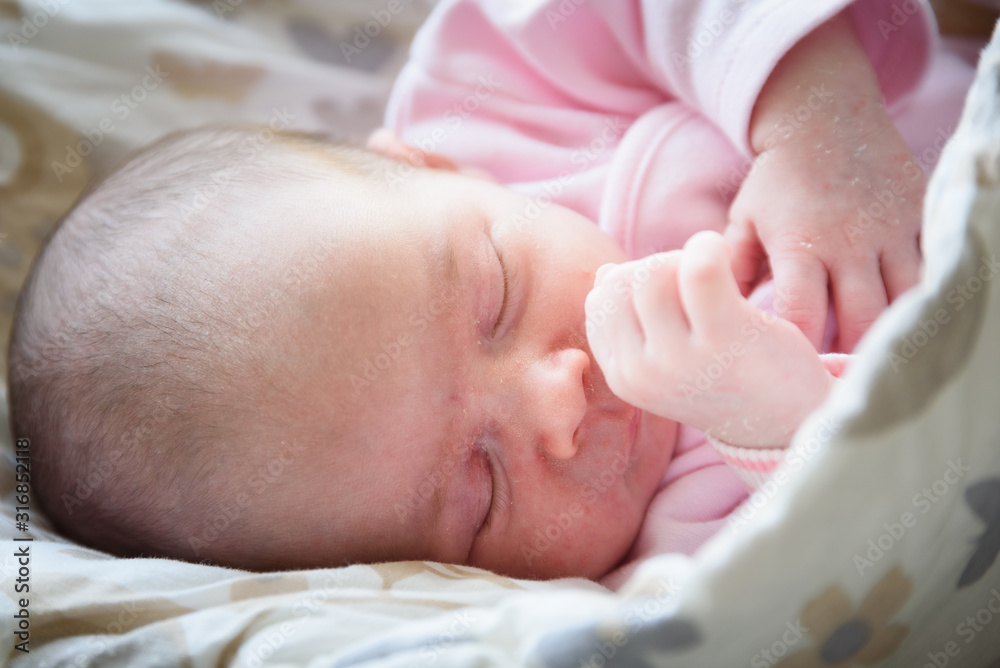 Sleeping newborn baby. Cute little girl one week old at home. Adorable lying on side covered with blanket. No retouch, newborn dry skin. Sleeping newborn baby. Cute little girl one week old at home. Adorable lying on side covered with blanket. No retouch, newborn dry skin.