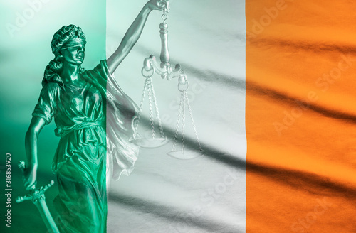 Fotografie National flag of Ireland with figure of Justice