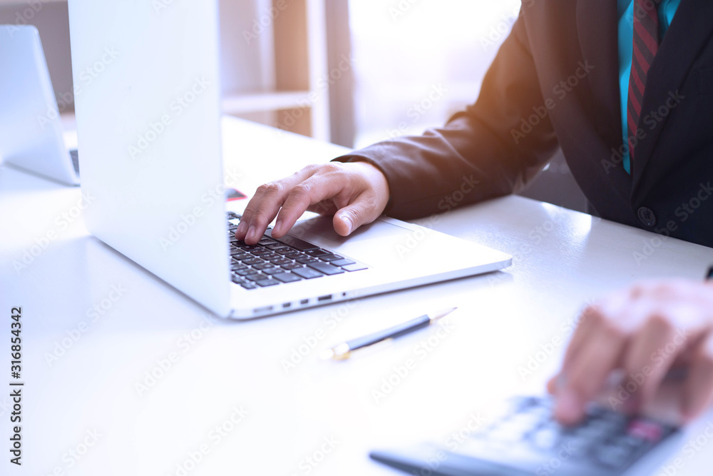 Businessman team is analyzing the cost of housing projects to live with lifestyle.business concept, soft focus, vintage tone Businessman team is analyzing the cost of housing projects to live with lifestyle.business concept, soft focus, vintage tone