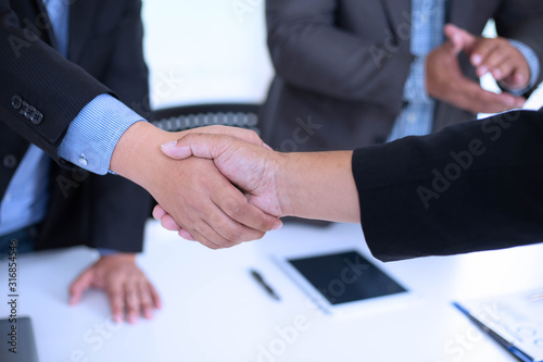 Business handshake Between manager to further invest in the future.business concept, soft focus, vintage tone © weerachai