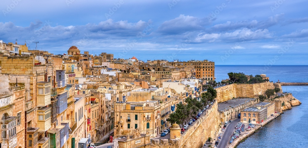 Valletta with traditional Maltese buildings with colorful shutters and balconies, Malta.