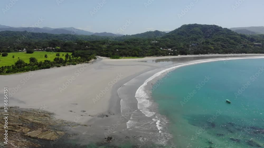 Aerial timelapse shot flying over the rocks at the western side of the bay at Samara. Samara, Costa Rica. Aerial timelapse shot flying over the rocks at the western side of the bay at Samara. Samara, Costa Rica.