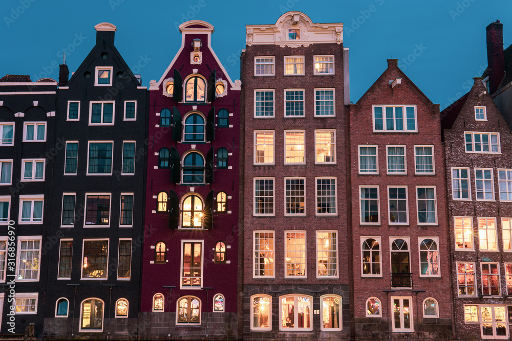 Buildings in Amsterdam Damrak at night