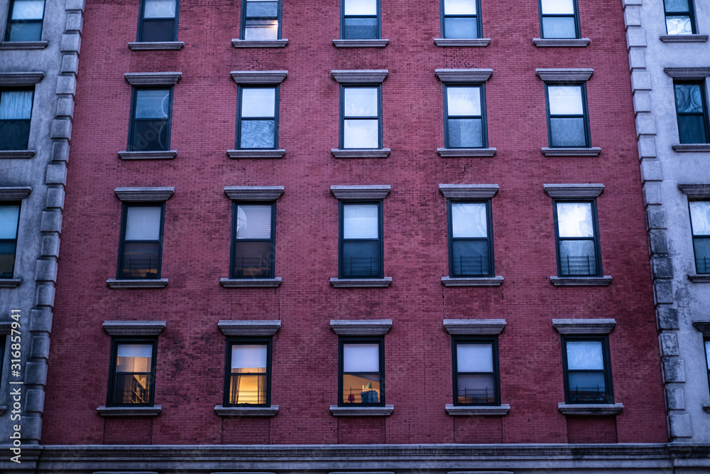 Red brick wall filled with windows