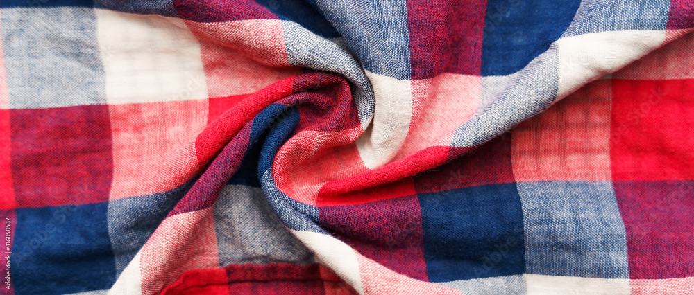 Plaid material texture. Red, blue and white cage clothes background Plaid material texture. Red, blue and white cage clothes background