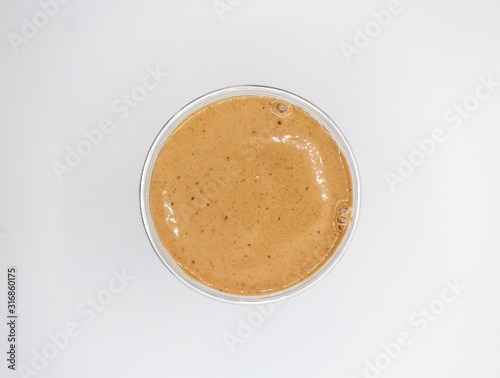 Aerial Shot Of A Brown Smoothie On A White Background photo