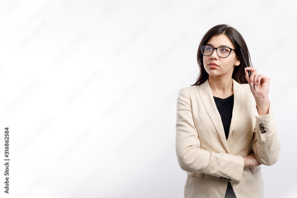 Pretty thoughtful female office clerk in glasses looking upwards isolated white background copyspace Pretty thoughtful female office clerk in glasses looking upwards isolated white background copyspace