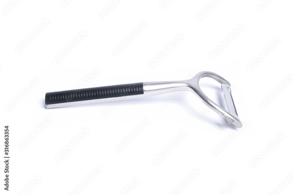 Vegetable peeler metal isolated in different poses on white background Vegetable peeler metal isolated in different poses on white background