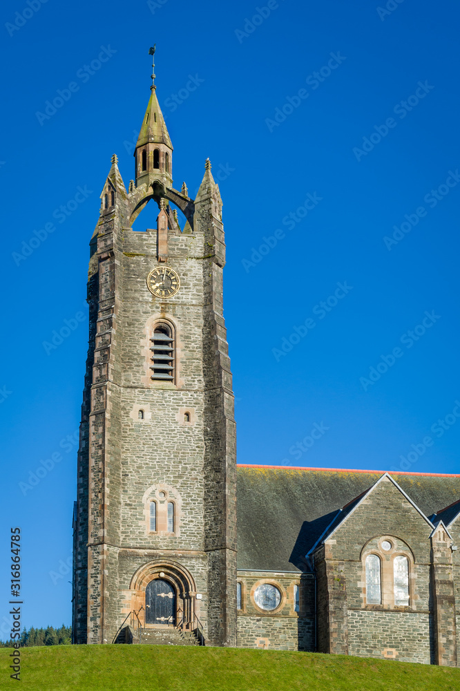 Vertical photo of Tarbert Parish Church tower. Hebrides, Scotland.