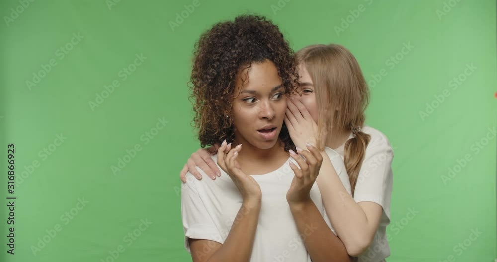 Two beautiful women gossiping Two beautiful women gossiping