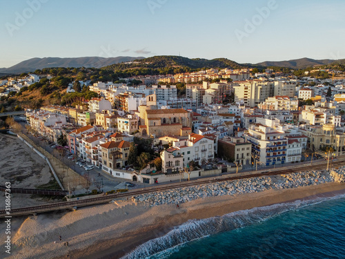Aerial view of Sant Pol de Mar village and its church Ermita de Sant Jaume. Located in el Maresme coast, Catalonia. photo