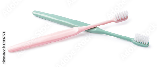 Different tooth brushes on white background