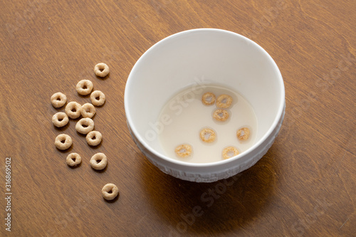 Empty bowl of children s cereal on a wooden table
