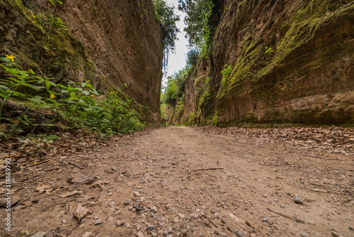 Via Cave natural caves country roads near Sovana Sorano Pitigliano in Tuscany Italy with green nature and rocks photo