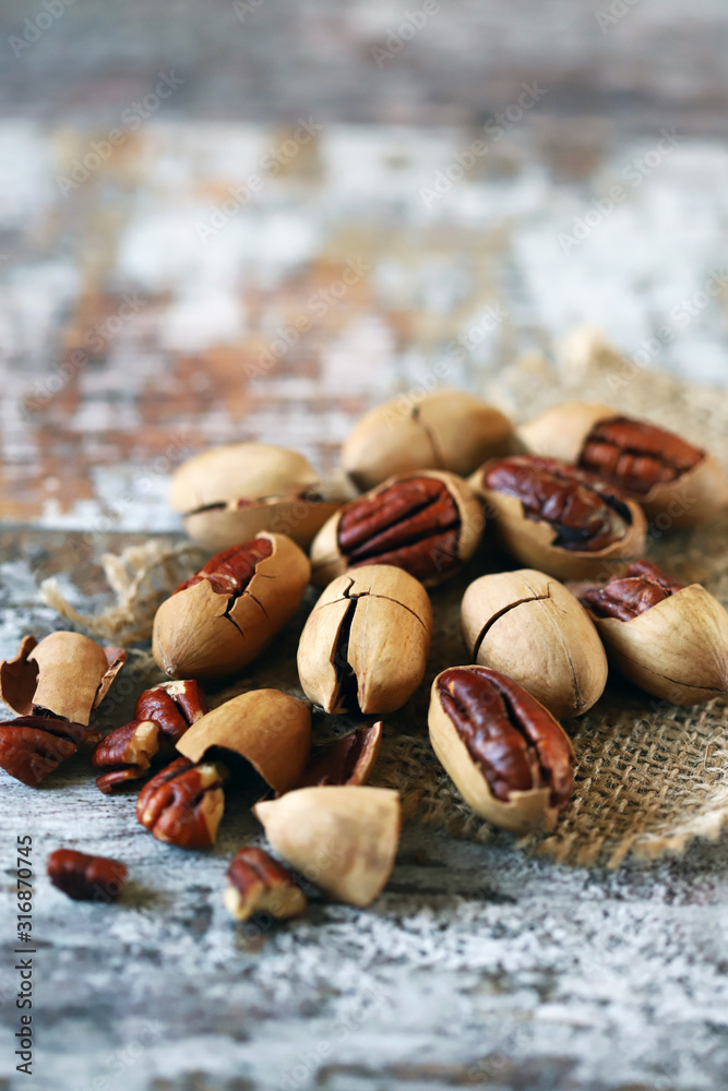 Fototapeta premium Pecans Selective focus. Macro. Useful nuts.
