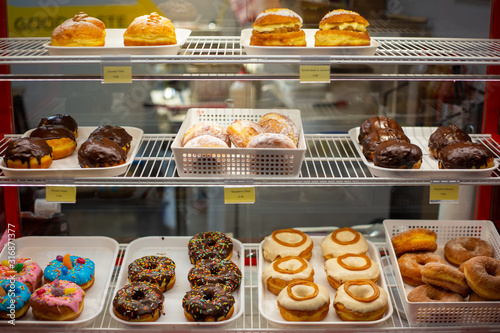 A selection of delicious sweet donuts for sale in a cafe in Christchurch city, New Zealand