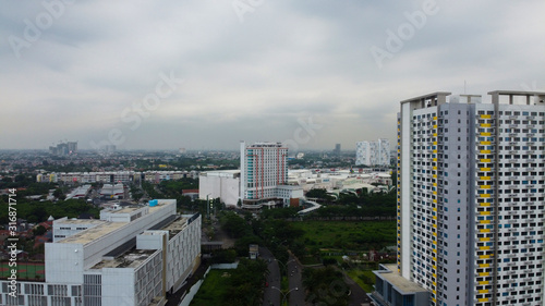 Bekasi, West Java, Indonesia - January 21 2020: Aerial landscape of modern apartment building in Bekasi central business district from a drone.