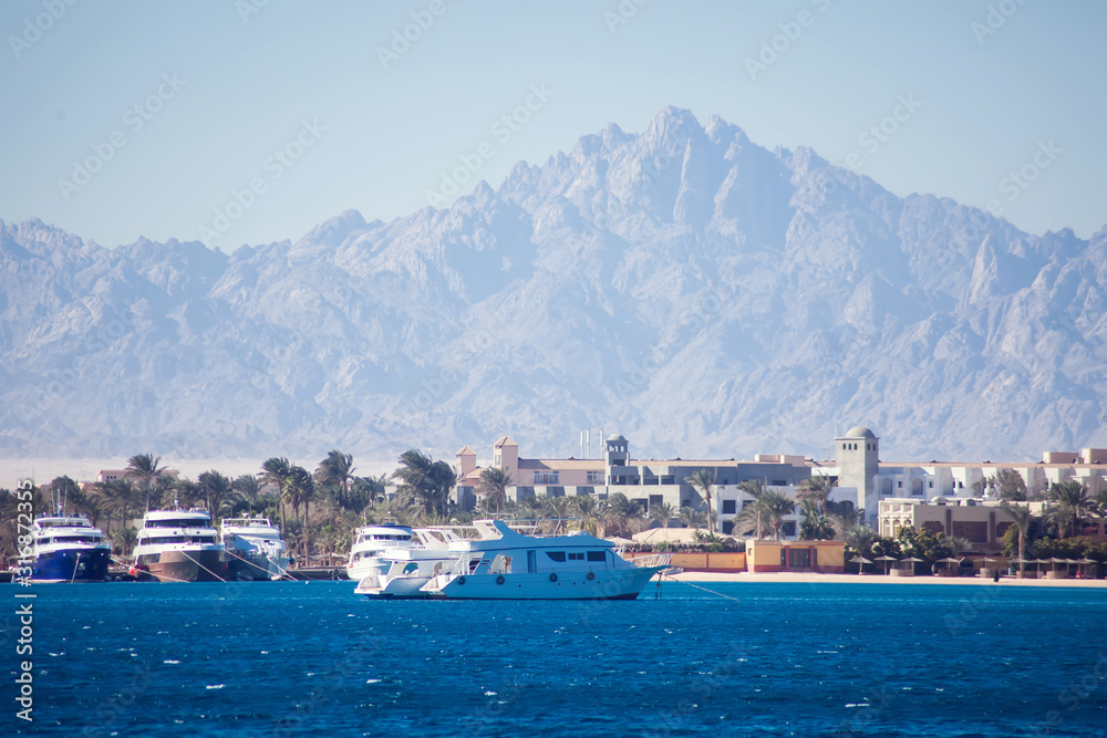 The view of sea, town and mountains in Hurghada, Egypt. Tourism and travel concept