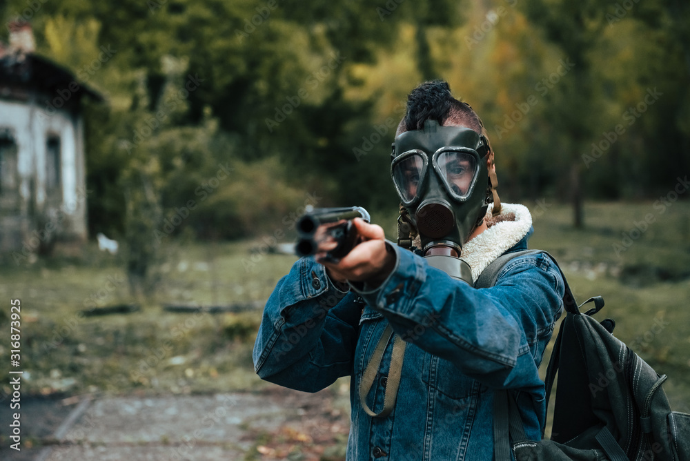 woman with punk style, with gas mask, backpack and double barrel shotgun.  post-apocalyptic, military and airsoft war games concept. Stock Photo |  Adobe Stock