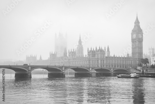 Monochrome misty view of Big Ben and the Houses of Parliament with Westminster Bridge, London, UK