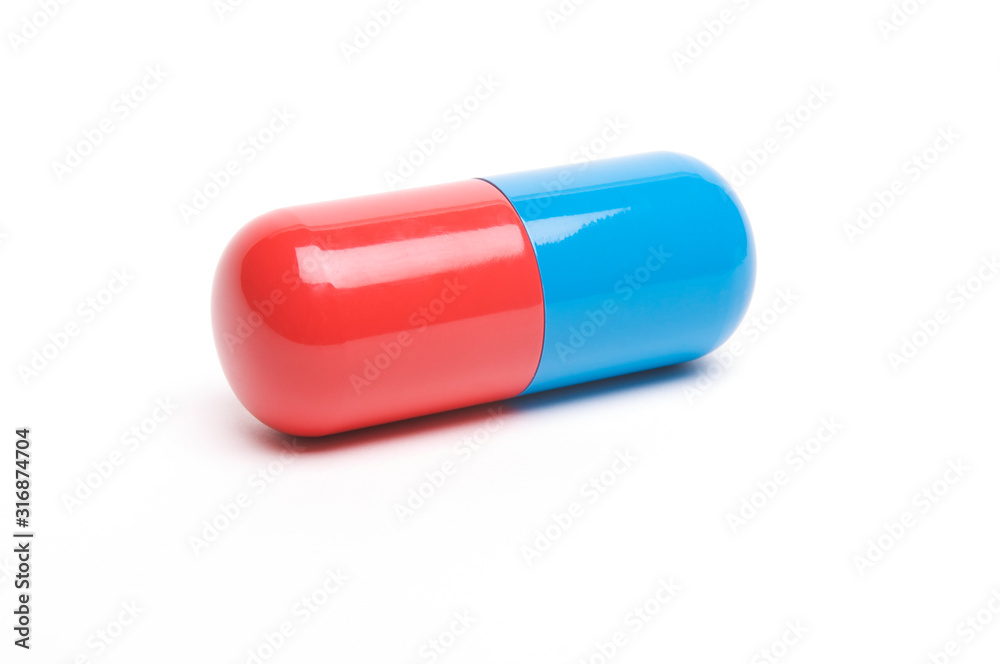 Big shiny red and blue capsule sitting with shadow on white background Big shiny red and blue capsule sitting with shadow on white background
