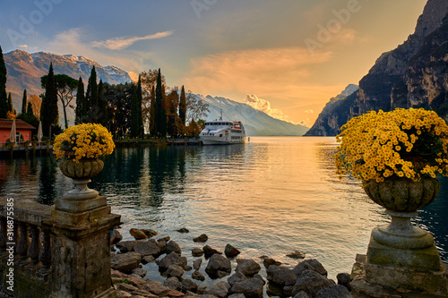 Beautiful and colorful autumn in Riva del Garda, Garda lake surrounded by mountains, Trentino Alto Adige region, Lago di garda, italy