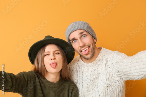 Young couple taking selfie ...