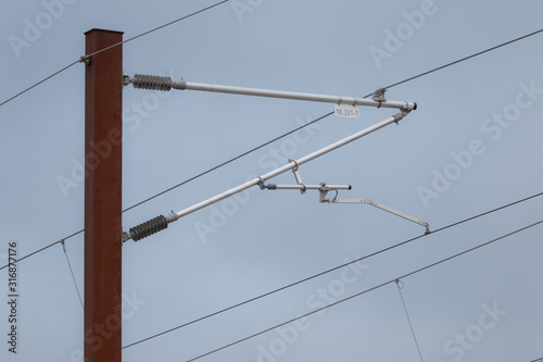 Overhead live electric railway train power supply photo