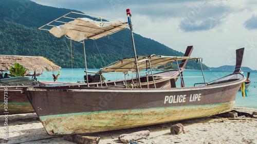 Old Police Boat on Sand Beach, Koh Lipe Thailand