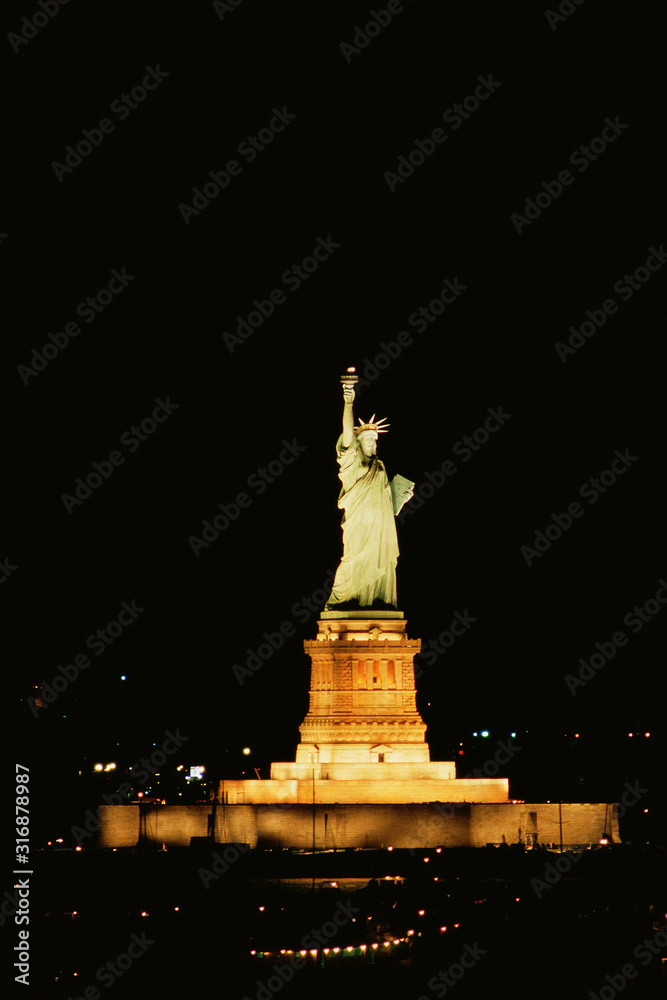 Statue of Liberty illuminated at night Statue of Liberty illuminated at night