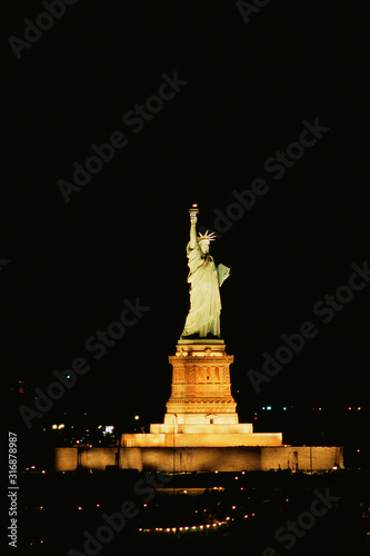 Statue of Liberty illuminated at night