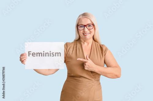 Woman holding paper with wo...