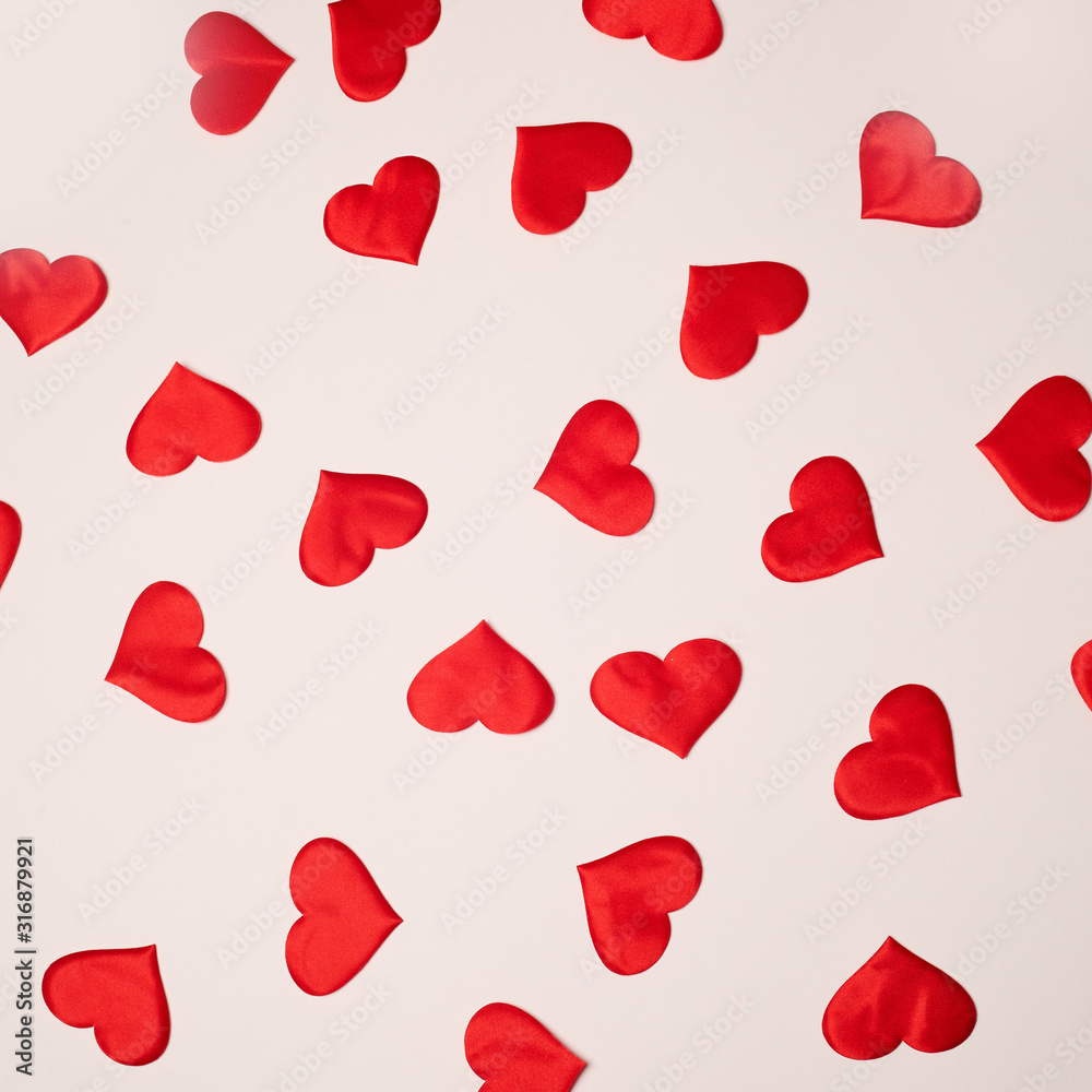 Valentine's Day. Many red hearts on a white background. Texture. Valentine's Day. Many red hearts on a white background. Texture.