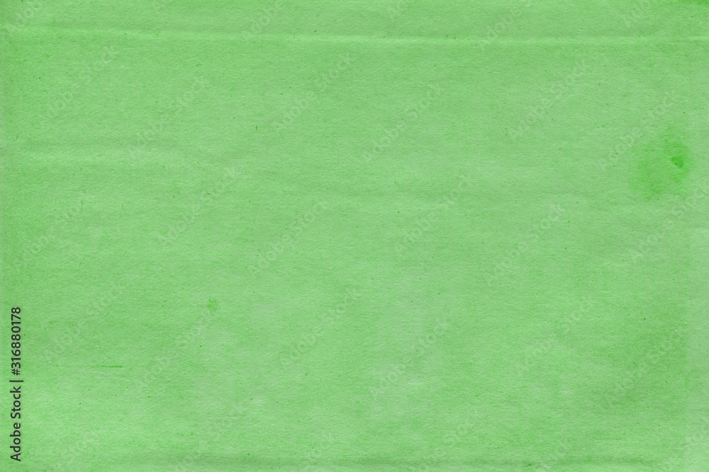 Fototapeta premium Cardboard green abstract pattern texture close-up. Retro old paper background. Grunge concrete wall. Vintage blank wallpaper.