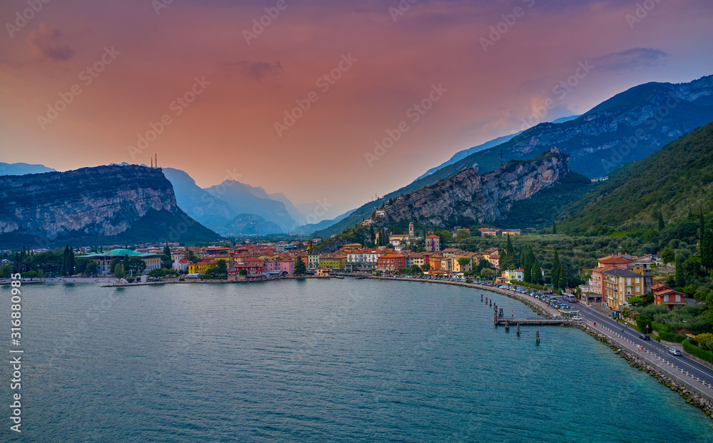 Panorama of Torbole a small town on Lake Garda, Italy. Europa, beautiful Lake Garda surrounded by mountains in the summer time