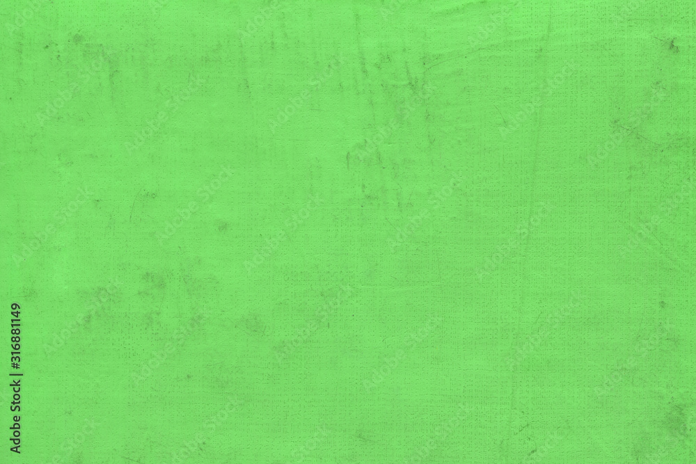 Cardboard green abstract pattern texture close-up. Retro old paper background. Grunge concrete wall. Vintage blank wallpaper.