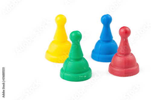 Colorful figures for ludo family board game isolated on the white background. Copy space.