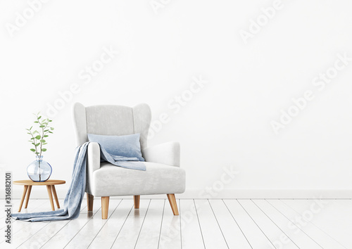 Living room interior wall mockup with light gray velvet armchair, blue pillow, plaid, coffee table and green plant branch in vase on empty white wall background. 3D rendering, illustration.