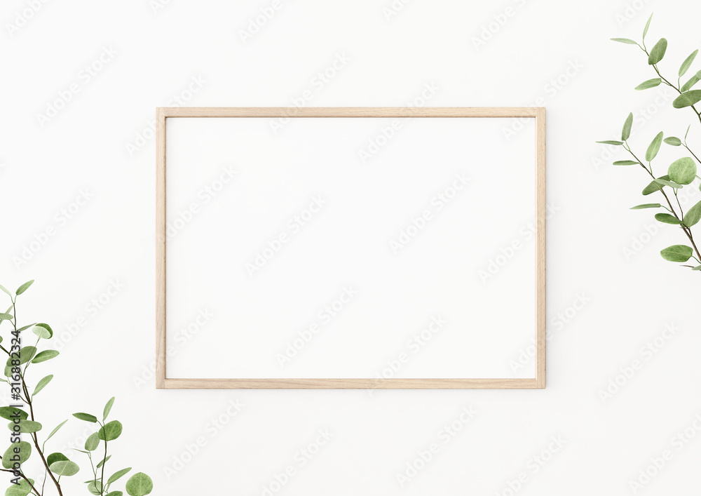 Fototapeta Interior poster mockup with horizontal wooden frame on empty white wall, decorated with plant branches with green leaves. A4, A3 size format. 3D rendering, illustration.